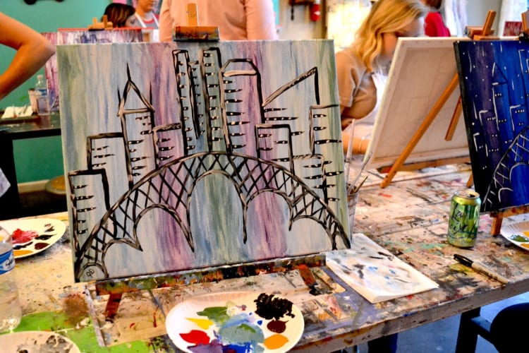 A painting of a skyline in an art class