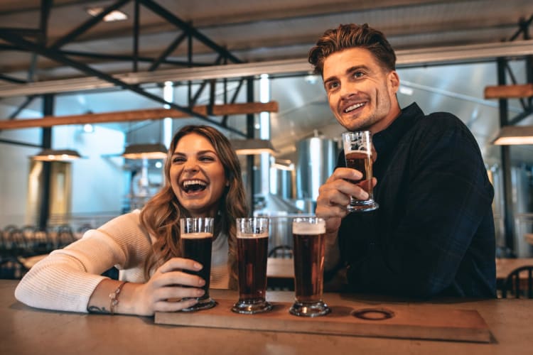 A couple having beer at a brewery