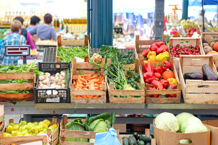 Vegetables in crates on display at a farmers market