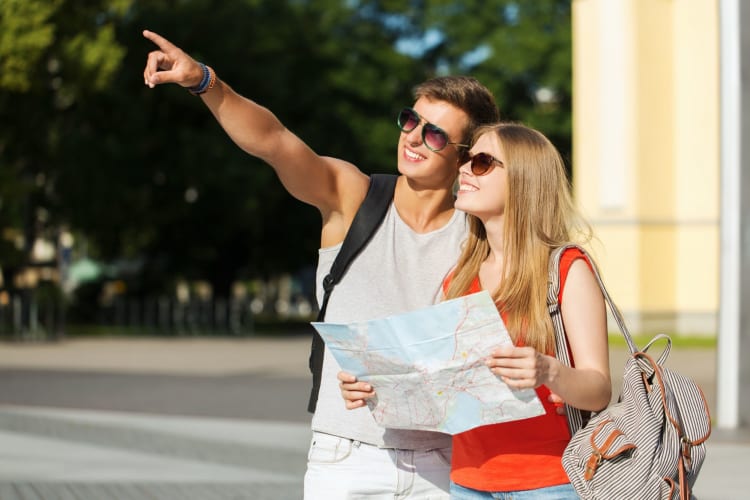 A couple exploring with a map.