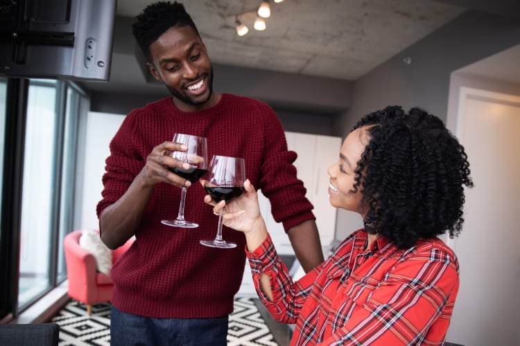 A couple having red wine