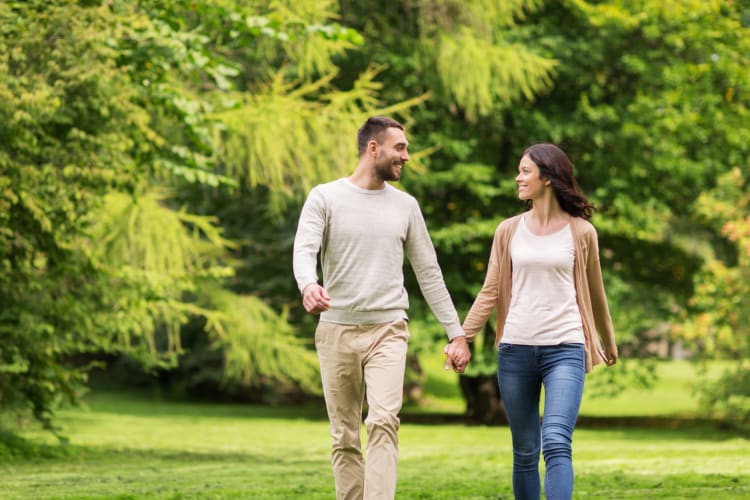 A couple walking in a park