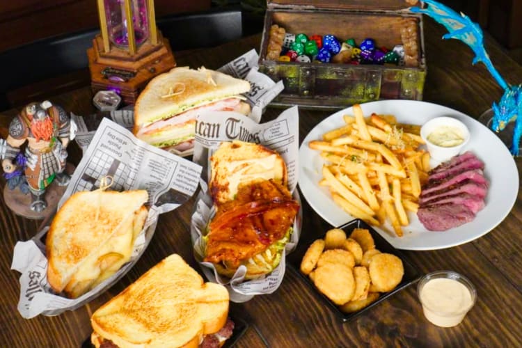 A selection of bar food on the table with figurines and games