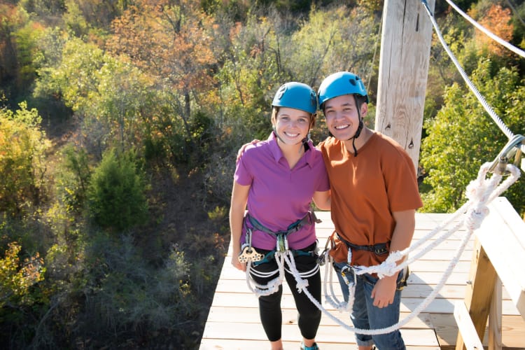 A couple on a zipline course