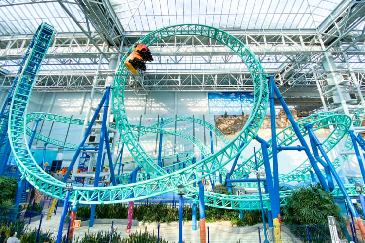 A blue indoor rollercoaster