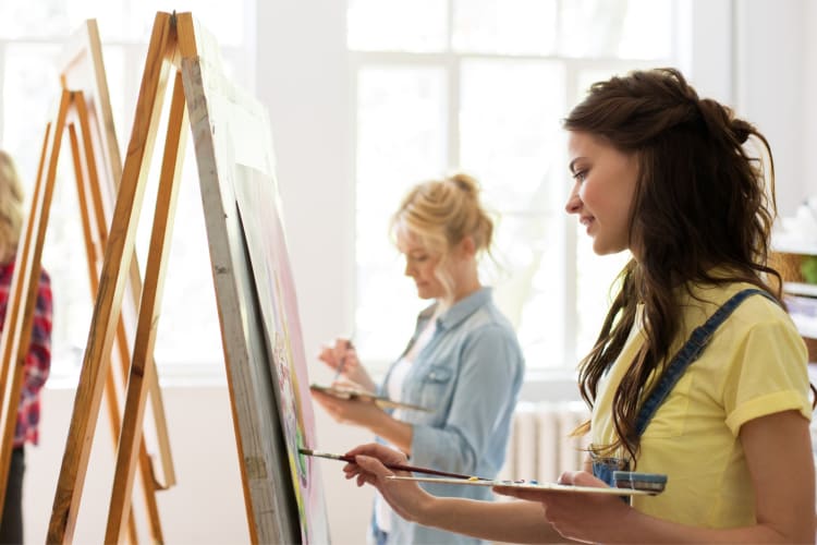 People painting in a painting class