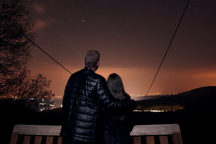 A couple looking at a starry sky