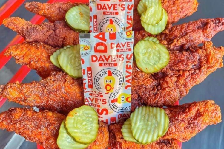 Hot chicken, pickles and Dave's Hot Chicken hot sauce packets