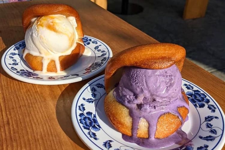 Two plates with bao buns each filled with ice cream