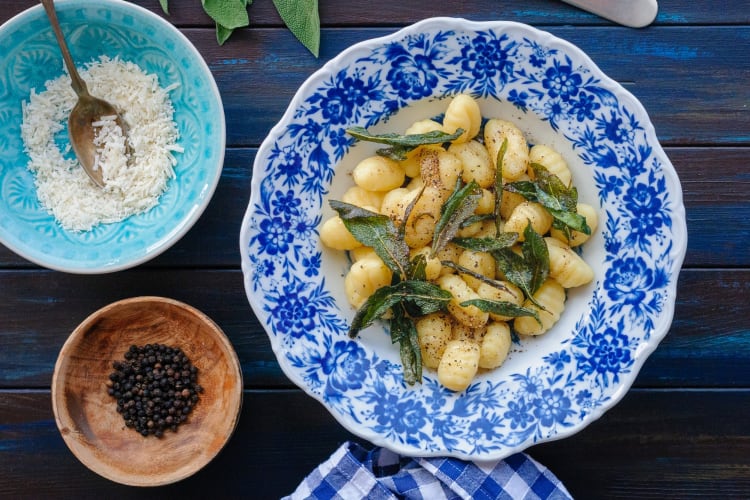 A bowl of gnocchi with sage