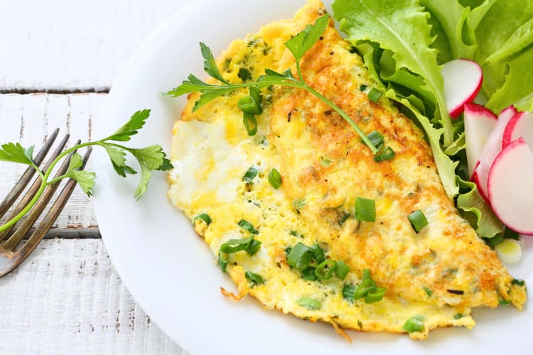 Omelette with radishes, onions and lettuce