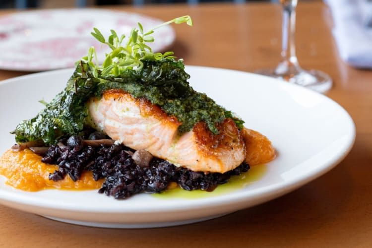 A fish dish on a wooden table