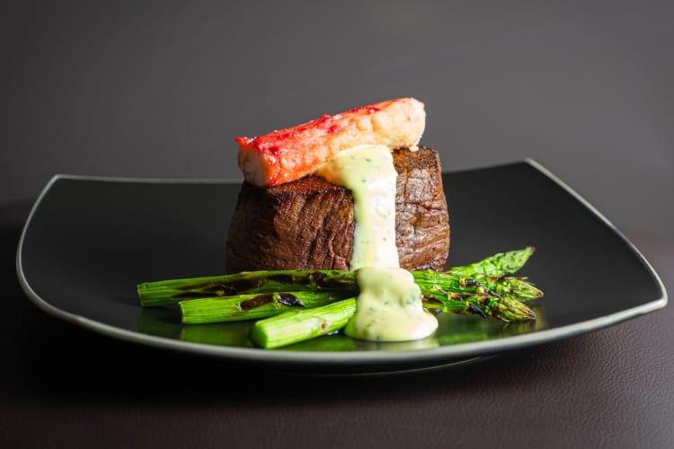 A steak with lobster and asparagus