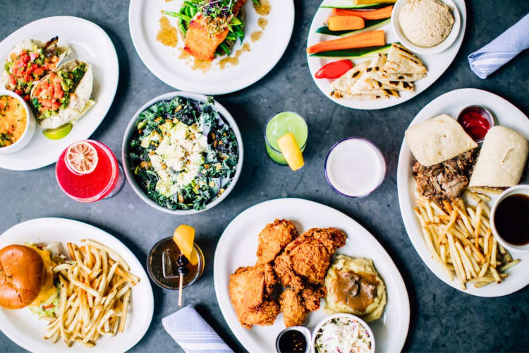 A selection of dishes and cocktails on a table