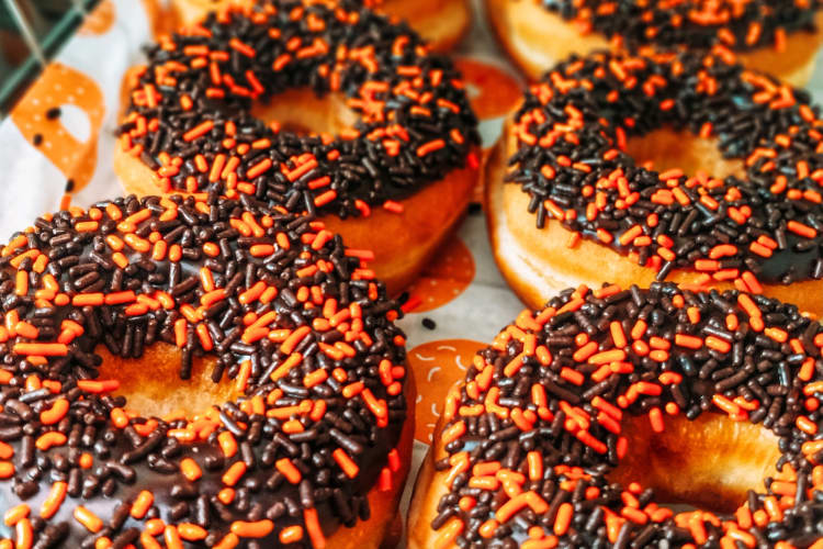 Donuts with orange and chocolate sprinkles