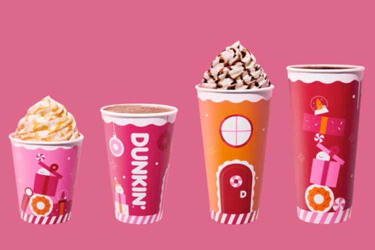 Four Dunkin' Donuts coffees on a pink background