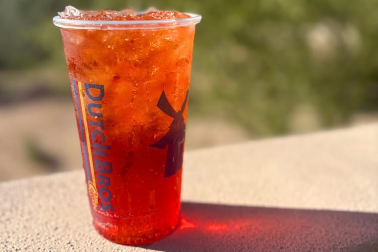 A red energy drink in a clear Dutch Bros cup