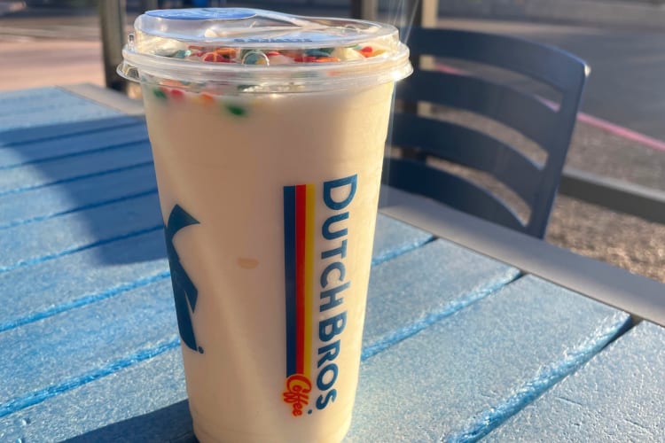 A Dutch Bros coffee with confetti sprinkles on top
