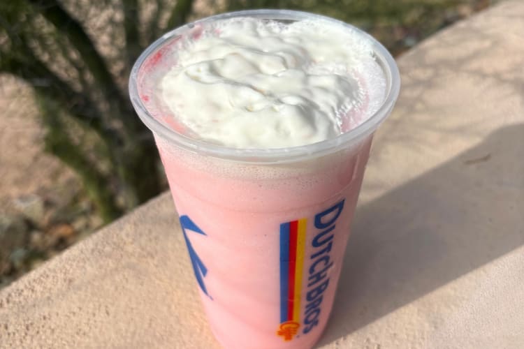 A strawberry drink with whipped cream topping from Dutch Bros