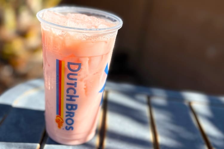 A light pink iced chai drink from Dutch Bros