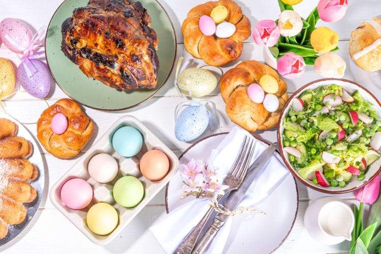 A selection of sweet and savory Easter dinner dishes and Easter decorations