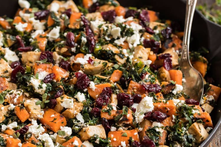 quick chicken sweet potato kale skillet with cranberries and goat cheese is a colorful and satisfying dish