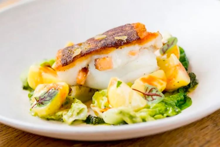 A delicious white fish dish with fresh vegetables