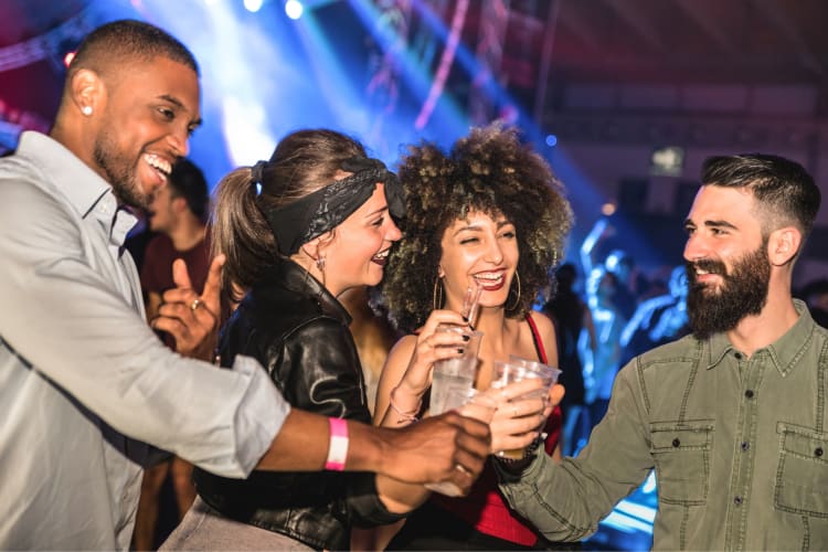 Four people having drinks in a nightclub