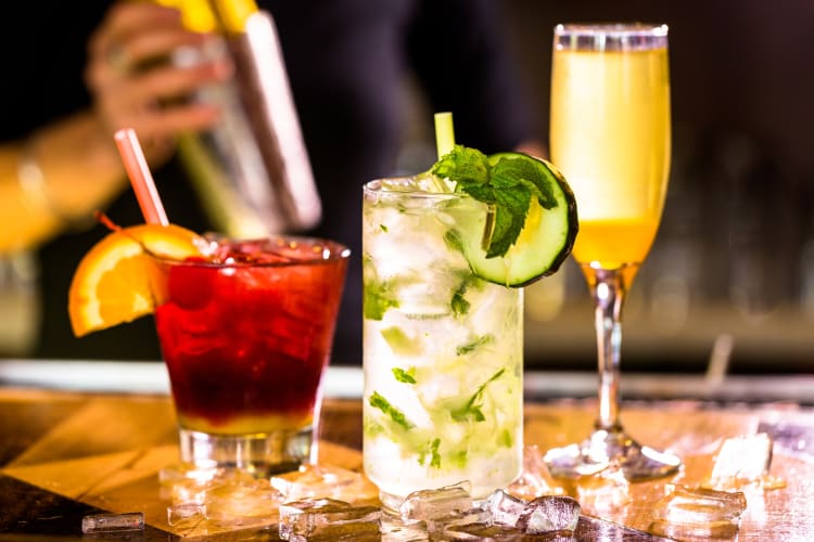 Three cocktails on a counter