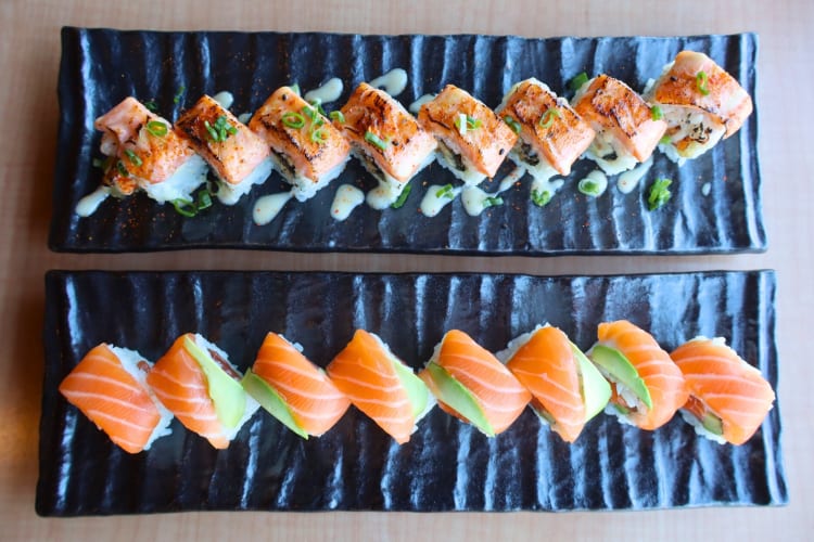 Two types of sushi rolls on a table