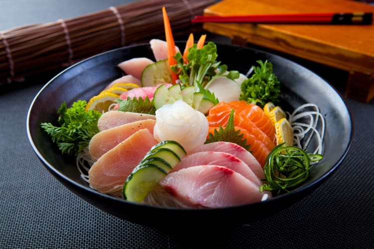 Various kinds of fish sashimi in a bowl