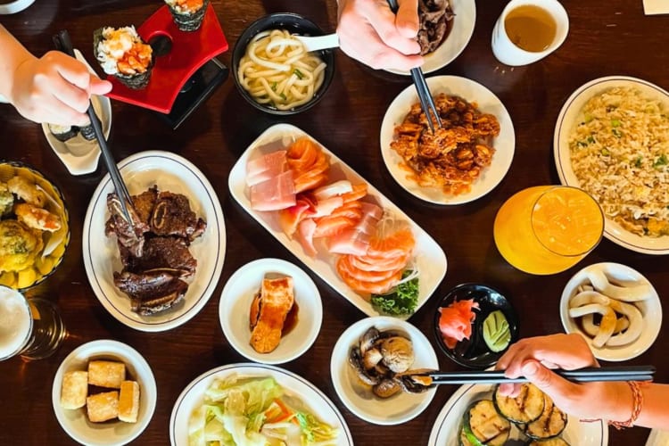 A selection of sushi and other Japanese dishes on a table
