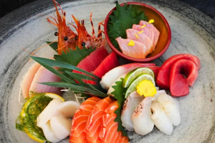 A selection of fish sashimi on a plate