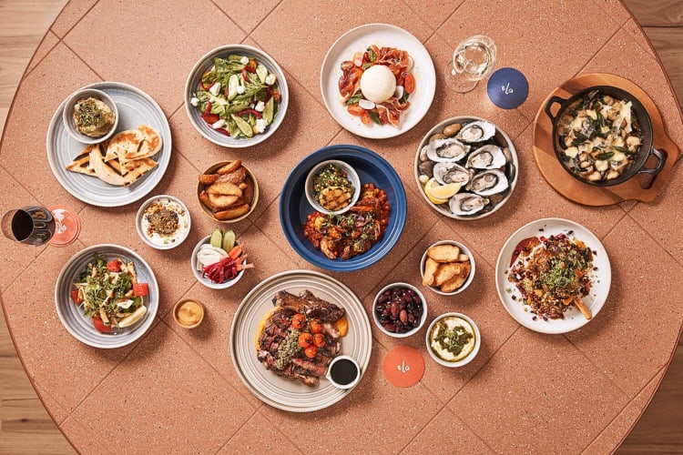 Aerial view of a variety of meals and drinks from Ela, a restaurant in Adelaide