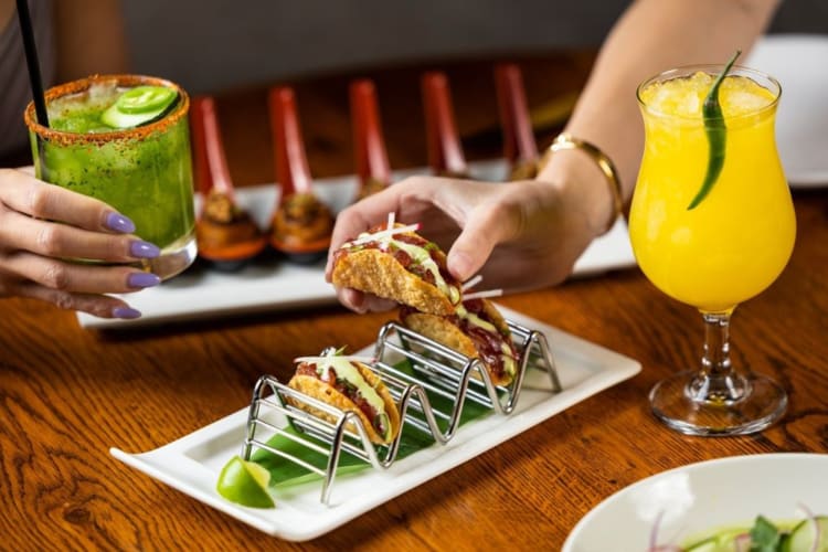 Tacos and cocktails on a table