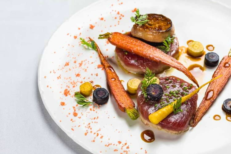 A high-end tuna steak and carrot dish