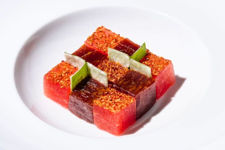 Cubes of raw tuna organized into a square 