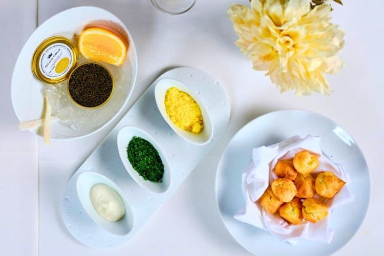 Caviar and garnishes on a table