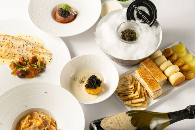 Fine dining dishes topped with caviar