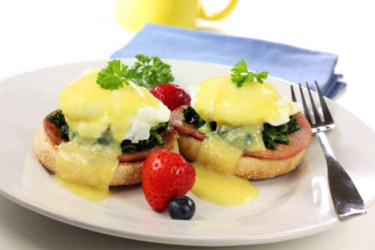 Eggs Florentine served with strawberries and blueberries