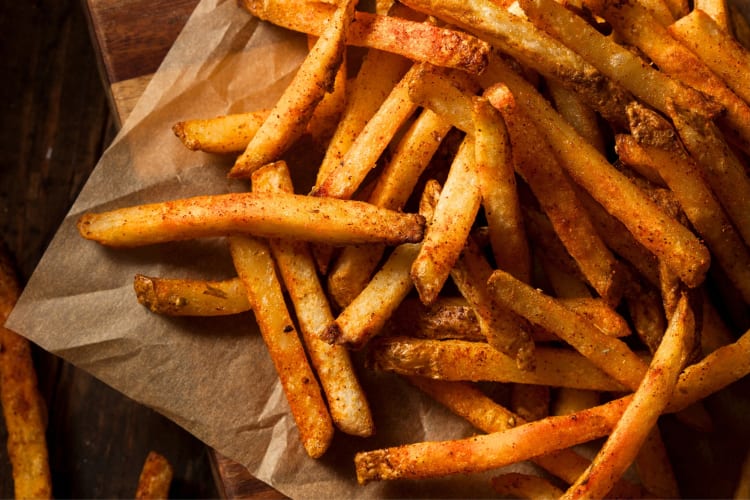 Cajun fries on brown paper