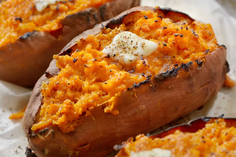 A baked sweet potato with butter