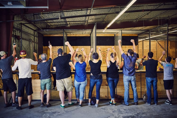 Friends celebrating at Urban Axes as a fun birthday idea in Cincinnati for adults