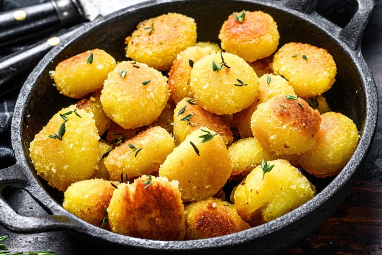 Roast potatoes in a cast iron pan