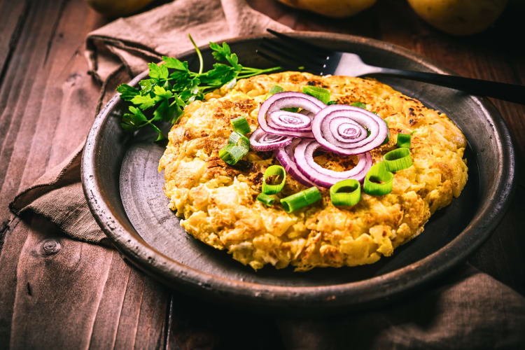 Omelette topped with green and red onions as a breakfast in Albuquerque
