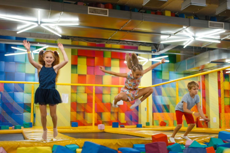 Kids jumping around at a trampoline park