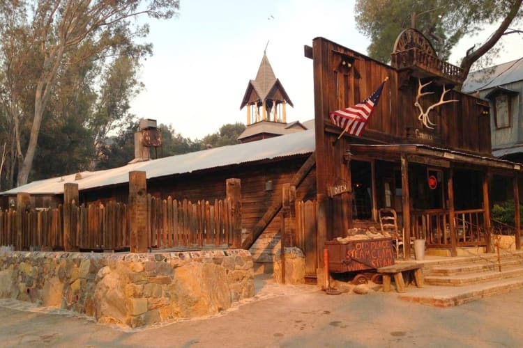 A Wild West style saloon next to trees