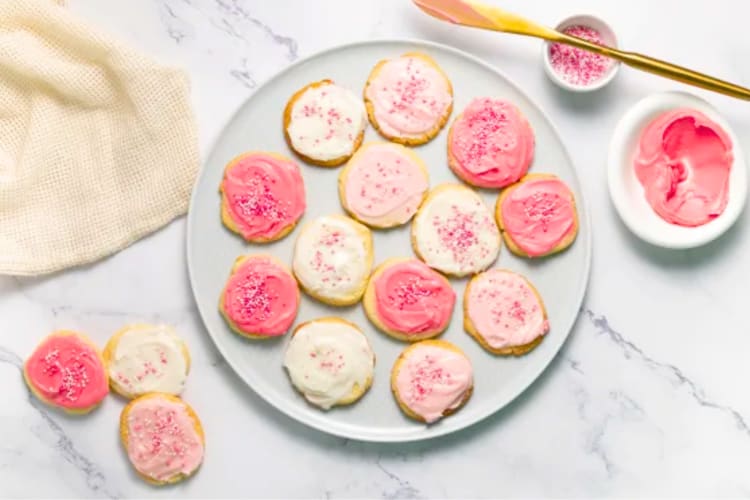 Round sugar cookies with pink frosting