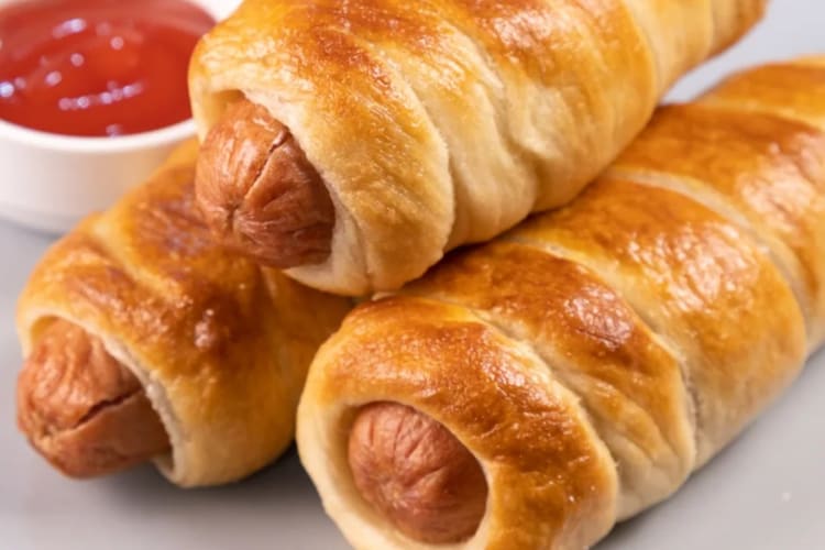 Buttery soft pretzel and plump hot dogs combine to form this delicious pretzel dog.