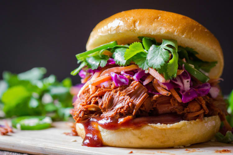 Close-up shot of a pulled pork sandwich